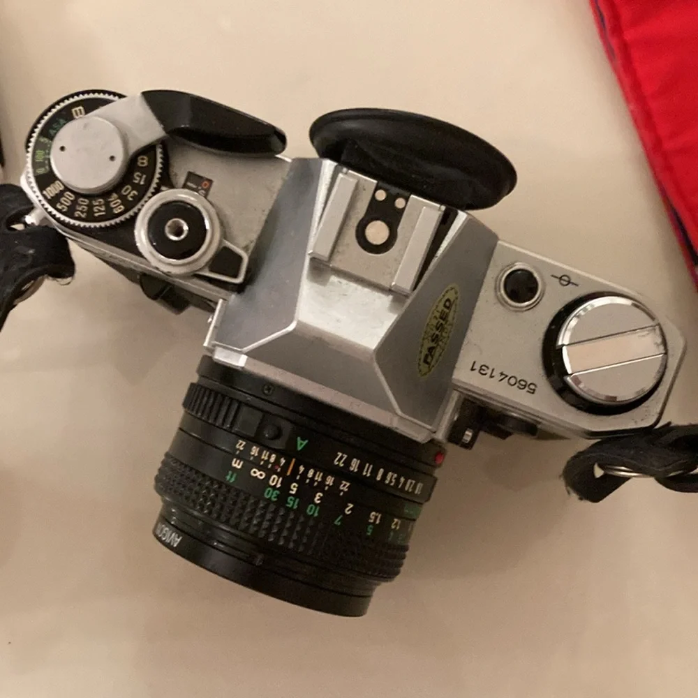Vintage Canon Camera with additional lenses.